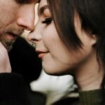 A tender close-up of a couple sharing a romantic and intimate moment outdoors, conveying love and connection.